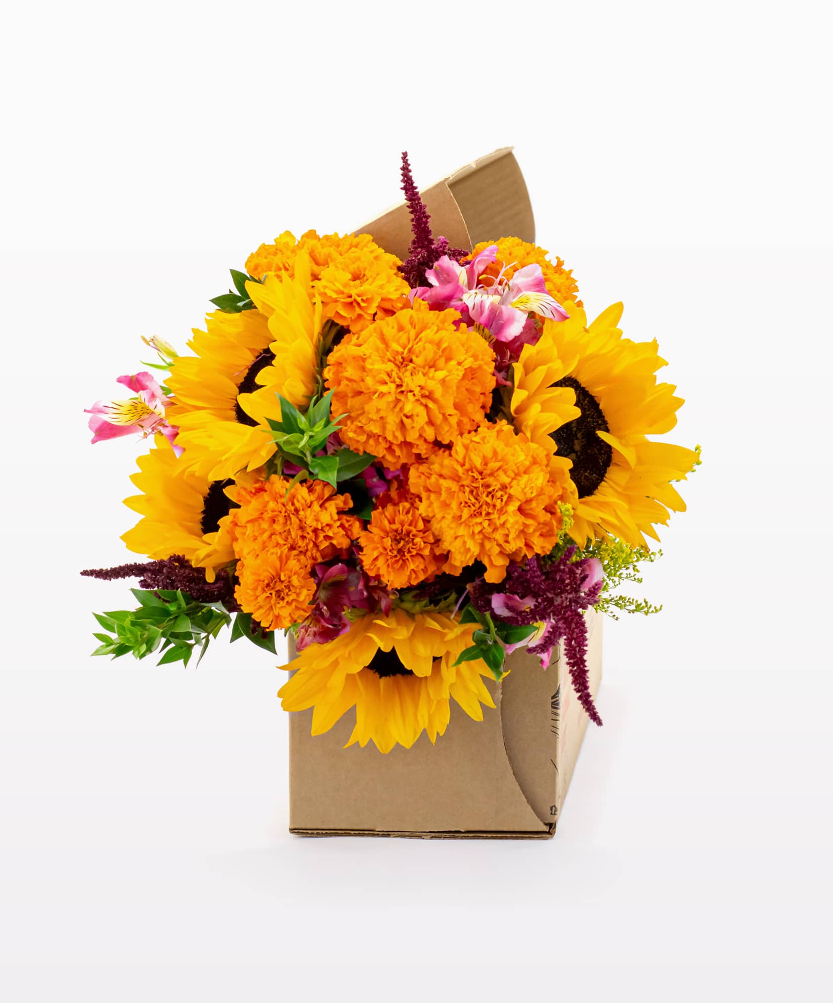Vibrant floral arrangement featuring yellow sunflowers and marigolds in a sturdy cardboard box.