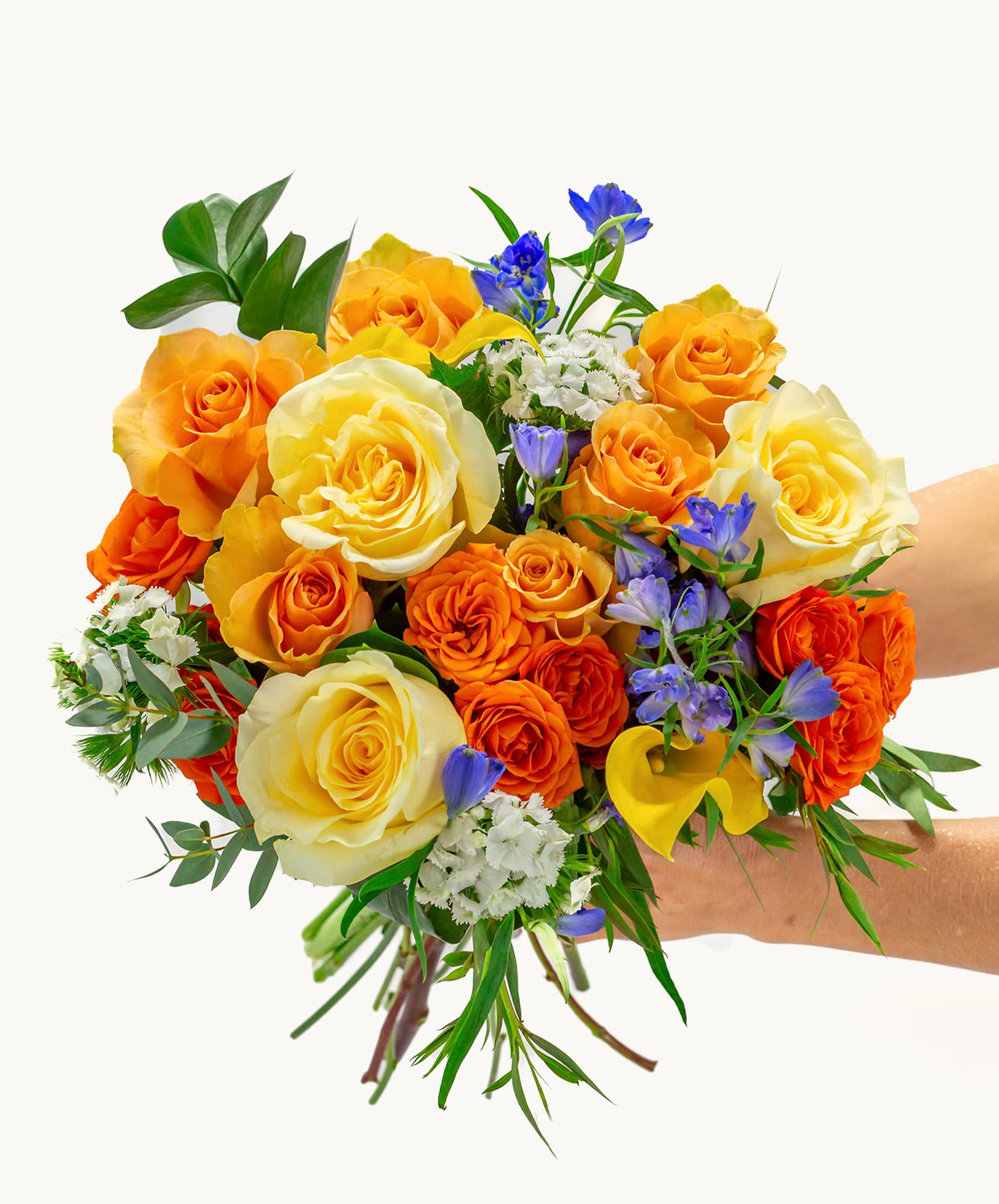 Vibrant bouquet of orange and yellow roses, accented with blue flowers and greenery.